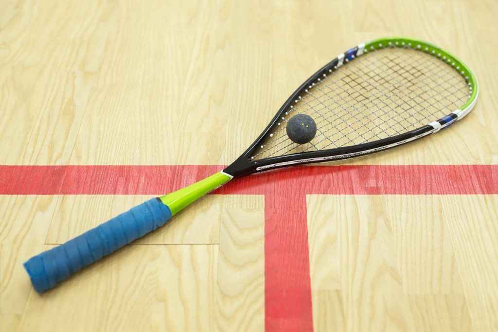 squash racket and ball on court